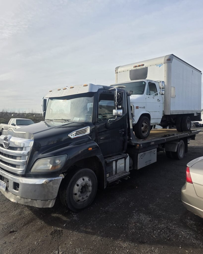 Tow truck parked in a vehicle yard