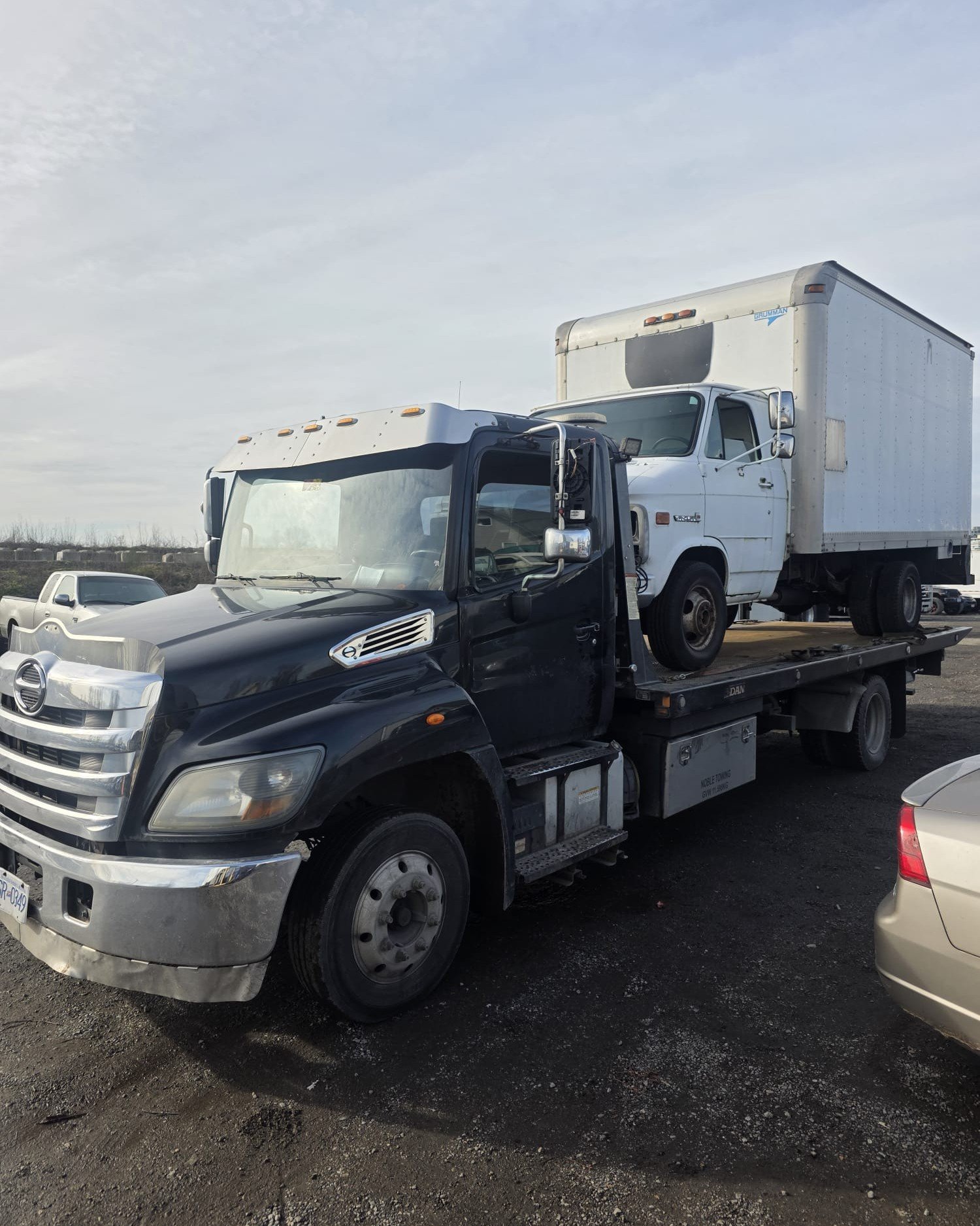 Tow truck parked in a vehicle yard