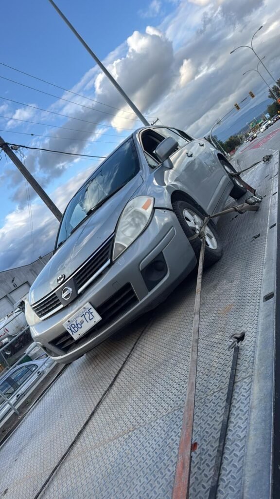 Silver Honda passenger car with its hood open